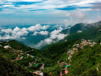 Captivating view of lush mountains and clouds in Mussoorie, India, showcasing natural beauty.