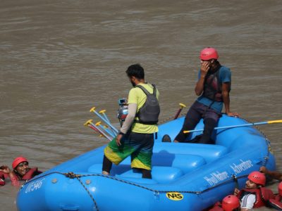 Experience thrilling white-water rafting on the Ganges at Rishikesh, with a team in action.